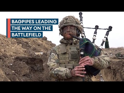 Highlanders piper performs in the trenches during Exercise Steadfast Dart